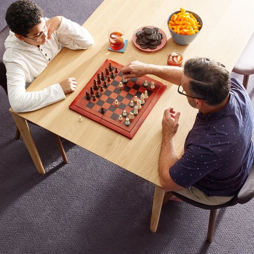 two people playing chess in a carpeted room - Carpet World of Martinsburg in WV