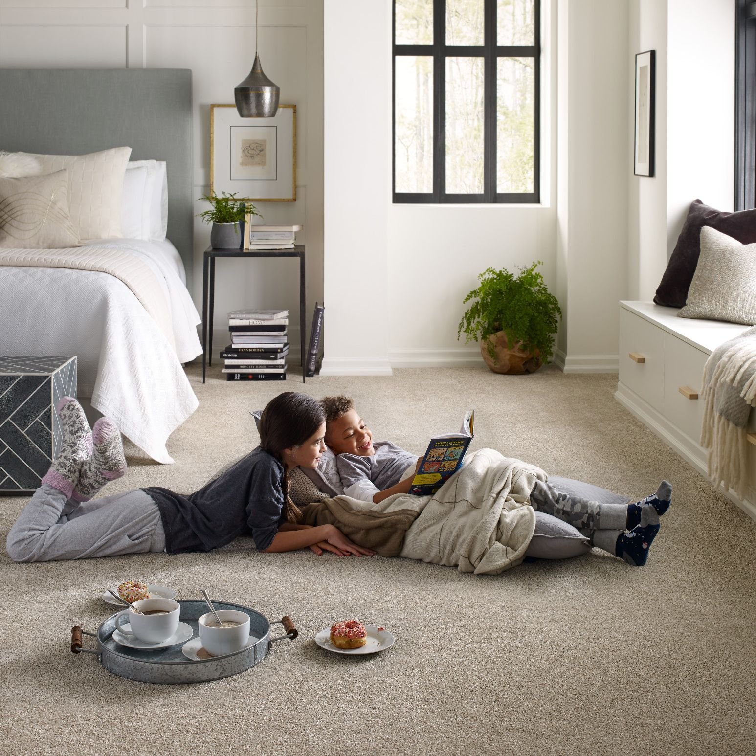 two people reading on a carpet bedroom floor - Carpet World of Martinsburg in WV