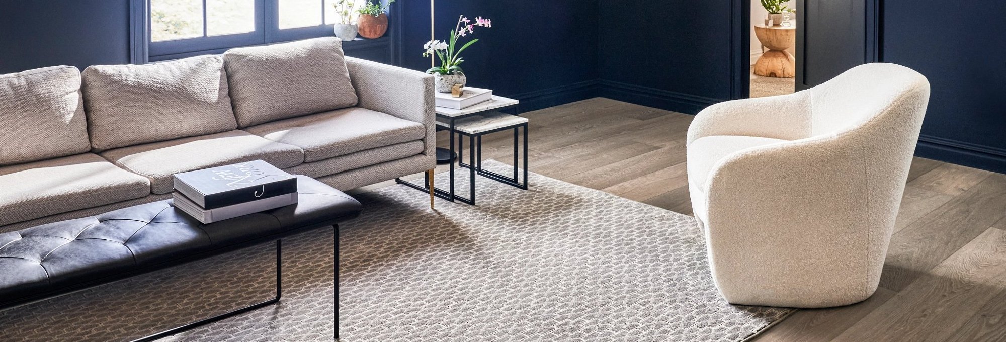 living room with hard floor and area rug - Carpet World of Martinsburg in WV